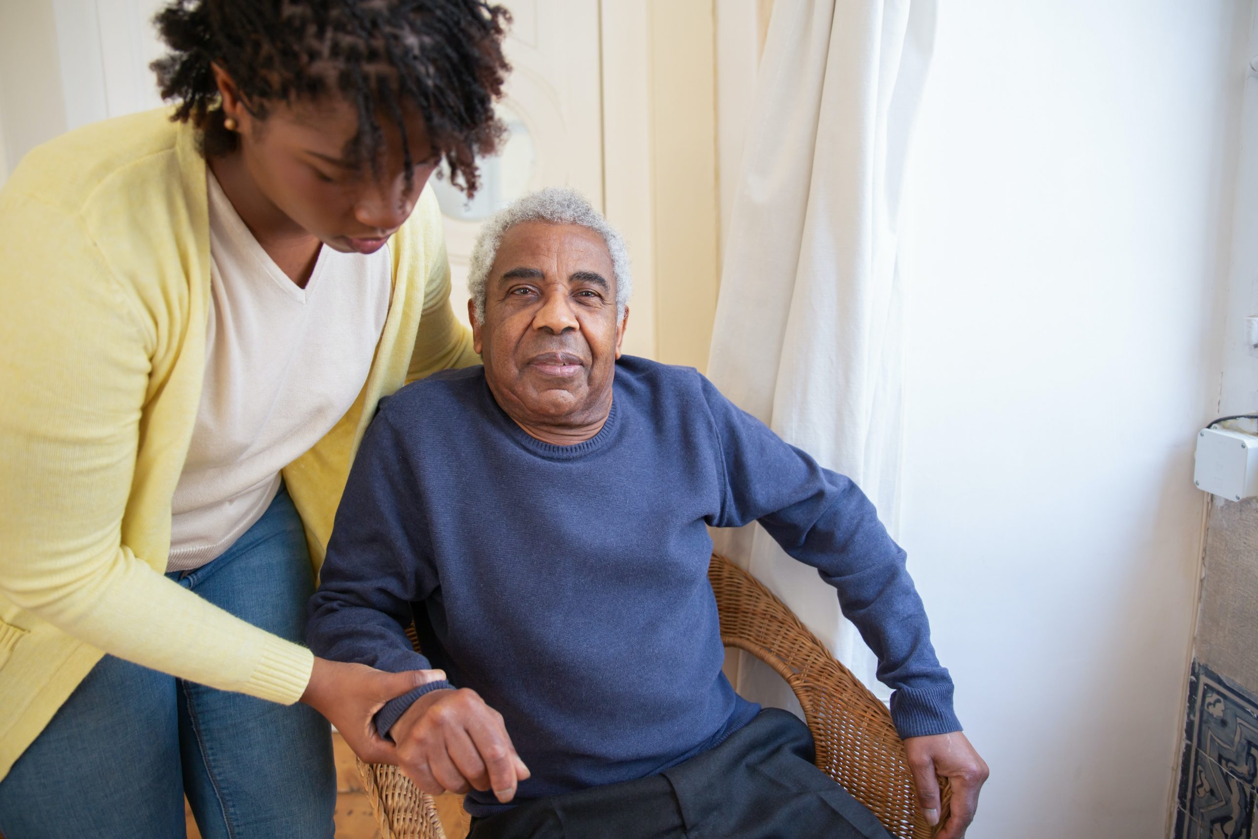 This picture depicts a Medicare recipient receiving home health care.