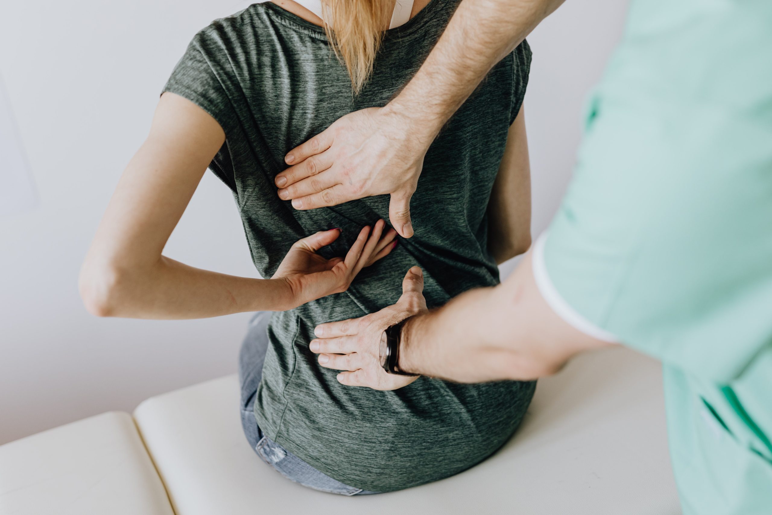 This picture depicts a person getting an adjustment with a chiropractor which is one of the many ways in which to better manage pain.
