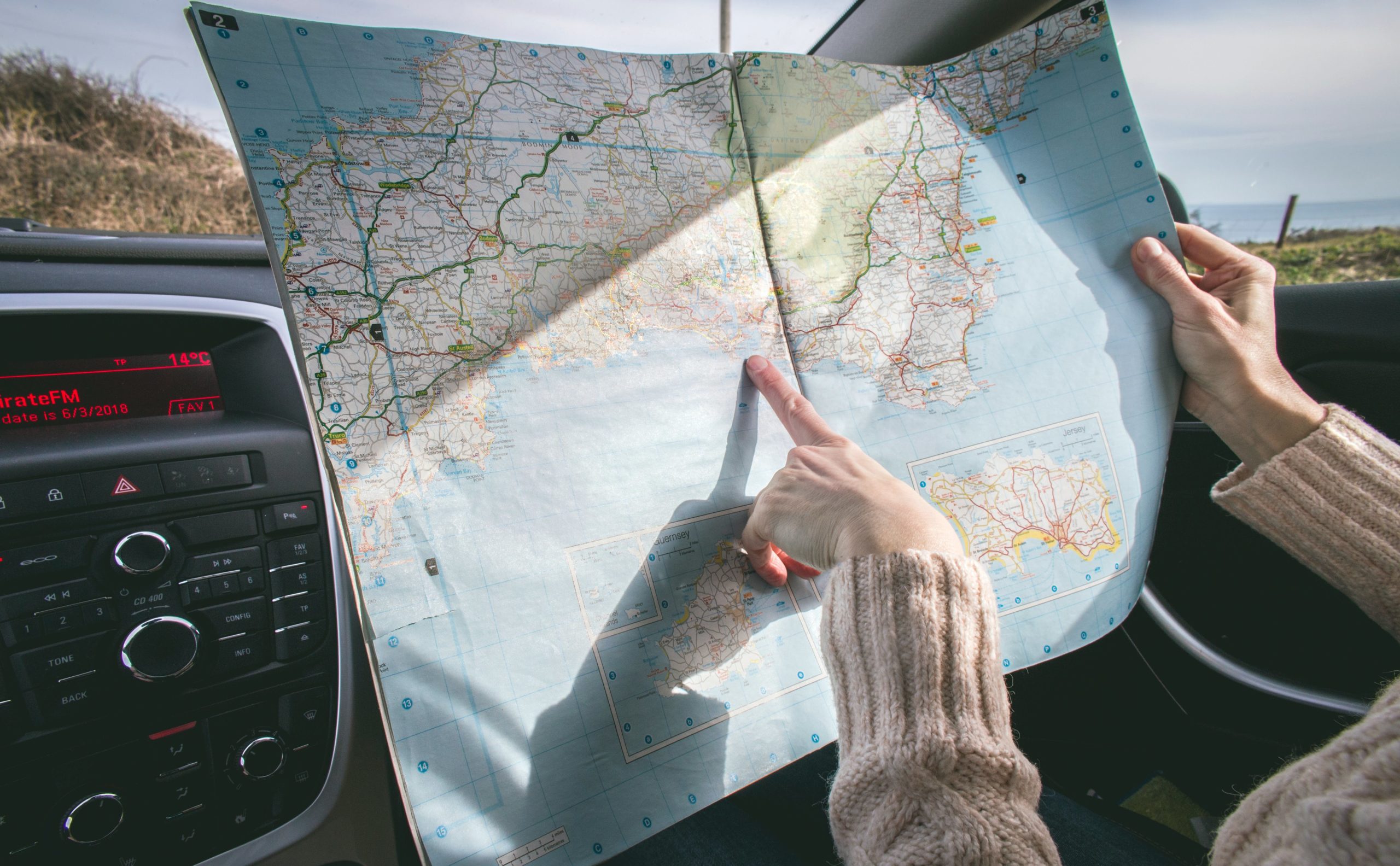 This picture depicts a Medicare Advantage recipient traveling with the help of a map.